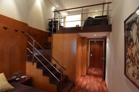 Entrance to and staircase inside duplex room at Hotel Pau Claris, Barcelona, Spain.