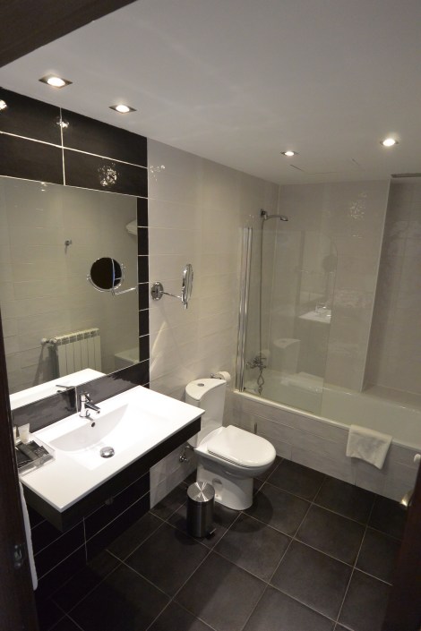 Bathroom in standard room at Hotel Puerta del Pamplona, Pamplona, Spain.